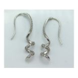 A pair of 9ct white gold with diamond earrings wit