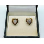 A pair of two colour 9ct gold heart shaped earring