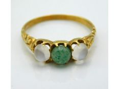An antique yellow metal ring set with moonstone &
