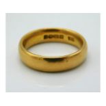 A 22ct gold band, size K/L, 6.8g