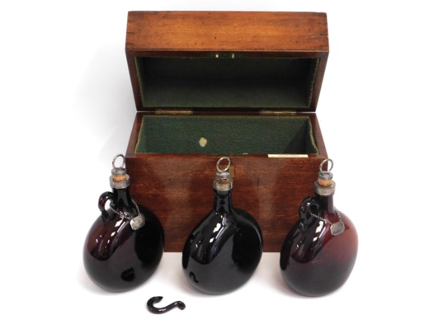 A set of three mid 19thC. glass bottle decanters with white metal fittings & two with small silver l