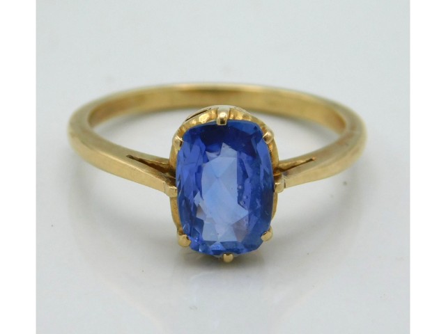 A yellow metal ring set with sapphire, tests electronically as 18ct gold, size N, 2.8g, sapphire siz