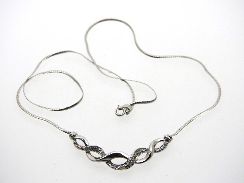 A 9ct white gold 16.5in long necklace set with twe