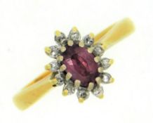 An 18ct gold ruby & diamond ring, ruby 6mm x 4mm, approx. 0.11ct diamond, 3.7g, size I/J