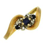 A 9ct gold ring set with small diamonds & sapphire
