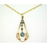A 17in long 9ct gold chain with Edwardian yellow metal 33mm drop pendant set with topaz & pearl, tes