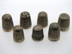 Seven silver & white metal thimbles including Char