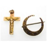 A 9ct gold crucifix, some wear/dents twinned with