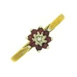 A 9ct gold ring with floral setting of small diamo