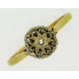 An 18ct gold ring set with small diamonds, wear to
