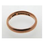 A 19thC. 9ct rose gold band, date letter for 1853,