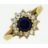 A 9ct gold ring set with sapphire & white paste st