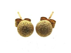 A pair of 9ct gold stud earrings with frosted fini