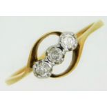 A 9ct gold trilogy ring set with three diamonds of