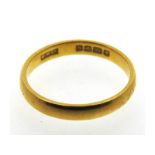 A 1953 22ct gold band by W. Wilkinson Ltd. 3.7g, s