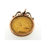 A 9ct gold mounted half sovereign pendant, 5.2g