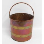 A copper & brass fireside bucket, 18in high to han