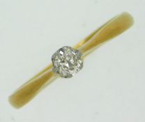 An antique 18ct gold solitaire ring set with plati