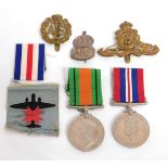 A WW2 medal set, a silver ARP badge & other badges