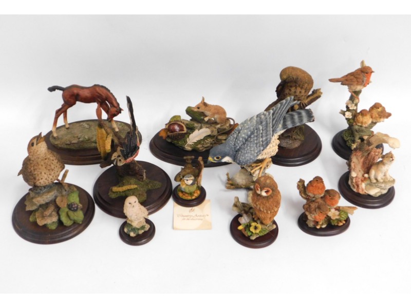 A quantity of model bird figures including Country