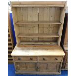 A 19thC. pine farmhouse dresser with drawers & cup