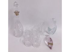 A silver collared decanter with matching glasses t
