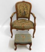 A carved walnut armchair with tapestried upholster