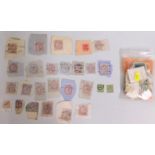 A small quantity of Victorian stamps on paper & a