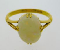 An 18ct gold ring set with opal, stone size 11mm x