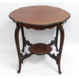 A mahogany Edwardian table. 29.5in diameter x 27.5