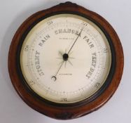 An oak mounted Whitmore & Son barometer, 10.25in d