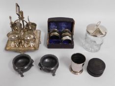 A silver plated egg cup set with stand twinned wit