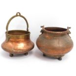 Two Persian style copper footed urns, largest 11.5