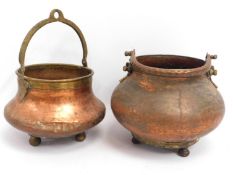 Two Persian style copper footed urns, largest 11.5