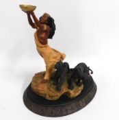 A decorative Country Artists resin figure of North