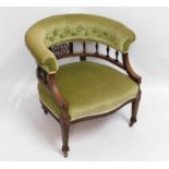 An antique upholstered button back armchair, 25.5i