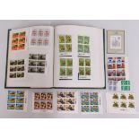 An album of British mint stamps including definiti