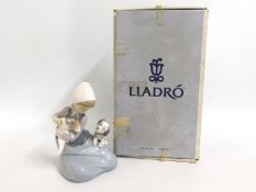 A boxed Lladro figure of a girl with kitten & pupp