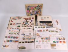 Two stamp albums & a quantity of first day covers