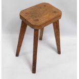 A pitch pine farmhouse stool with splayed legs, 21