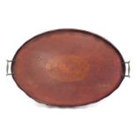An antique tray with inlaid decor, brass handles &