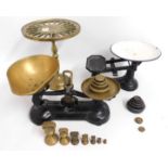 A brass set of kitchen scales, one other set, both