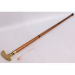 A brass 'golf putter' walking cane with drinks phi