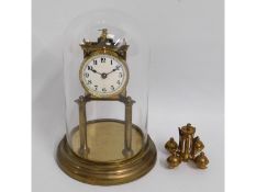 A brass anniversary clock with glass dome, 10.75in