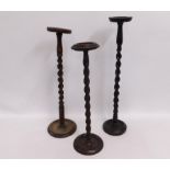 Three barley twist oak ashtray stands, tallest 29.