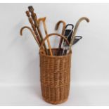 A wicker cane basket with contents including a sho