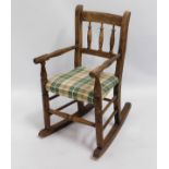 An oak child's rocking chair, 25.5in high