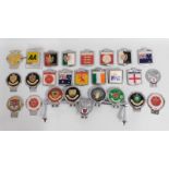 A collection of twenty six bumper motoring badges