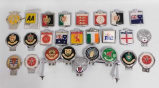 A collection of twenty six bumper motoring badges