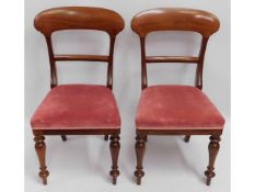 A pair of upholstered 19thC. walnut dining chairs,